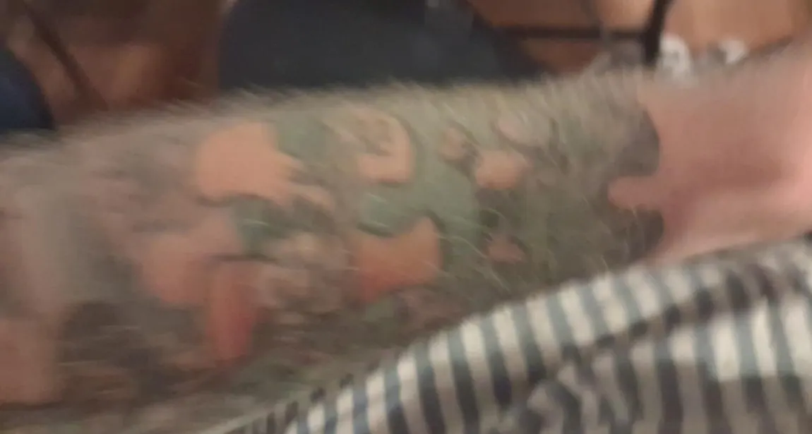 Original tattoo seen from another angle, with geometric puzzle forms